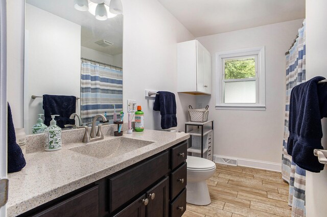 3341 Circle Dr, Saint Joseph, MI 49085 - bathroom featuring vanity, wood finished floors, and a shower with shower curtain