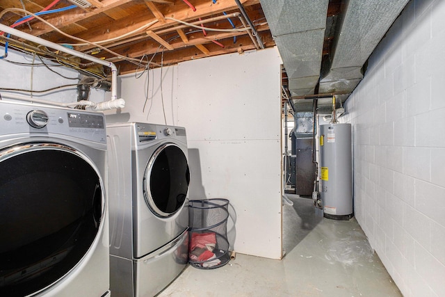 3341 Circle Dr, Saint Joseph, MI 49085 - laundry area featuring water heater, washing machine and dryer, and concrete block wall