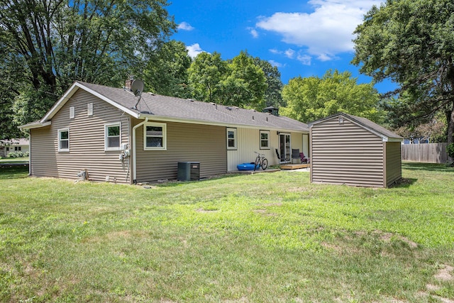 3341 Circle Dr, Saint Joseph, MI 49085 - rear view of house featuring roof with shingles and an outdoor structure