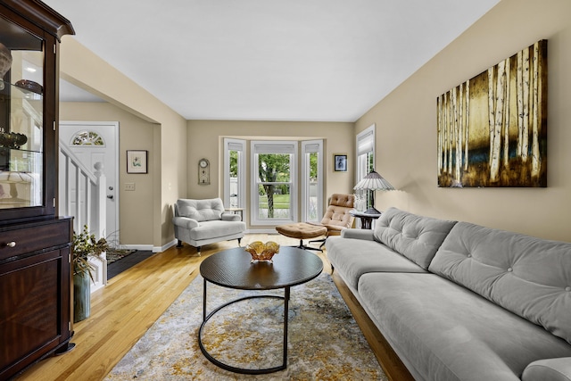 1015 Pointe Place Blvd, Rochester, MI 48307 - living room featuring light wood finished floors and stairs