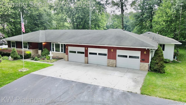 3775 Carrigan Rd, Fort Gratiot, MI 48059 - single story home with a garage, driveway, brick siding, a front yard, and a shingled roof