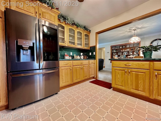 3775 Carrigan Rd, Fort Gratiot, MI 48059 - kitchen featuring stainless steel refrigerator with ice dispenser, dark countertops, glass insert cabinets, crown molding, and backsplash