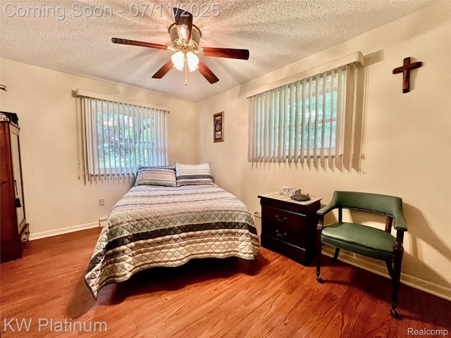 3775 Carrigan Rd, Fort Gratiot, MI 48059 - bedroom with a textured ceiling, wood finished floors, and ceiling fan