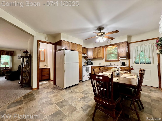 3775 Carrigan Rd, Fort Gratiot, MI 48059 - kitchen featuring white appliances, ceiling fan, light stone finish floors, under cabinet range hood, and light countertops