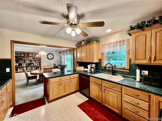 3775 Carrigan Rd, Fort Gratiot, MI 48059 - kitchen with black dishwasher, a peninsula, plenty of natural light, dark countertops, and recessed lighting
