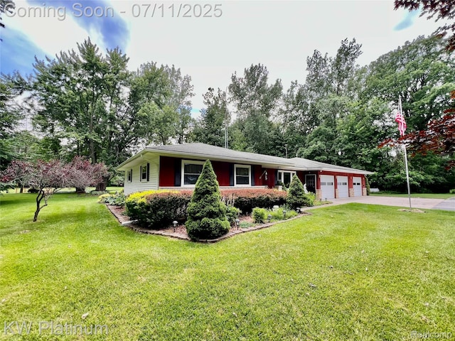3775 Carrigan Rd, Fort Gratiot, MI 48059 - view of front of house featuring an attached garage, a front lawn, driveway, and view of wooded area