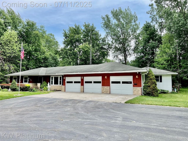3775 Carrigan Rd, Fort Gratiot, MI 48059 - ranch-style house featuring a garage, brick siding, driveway, a front lawn, and a shingled roof