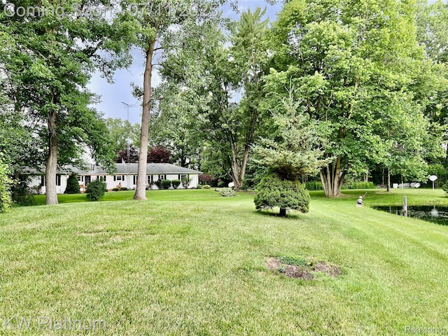 3775 Carrigan Rd, Fort Gratiot, MI 48059 - view of green lawn featuring view of scattered trees