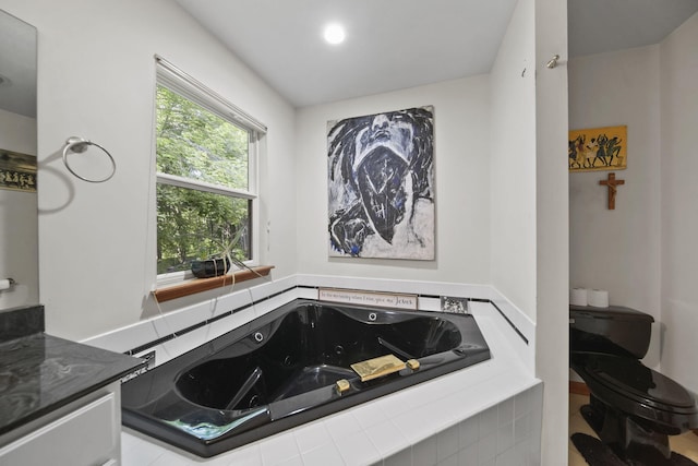 8395 Dalton Rd, Onsted, MI 49265 - full bath featuring a jetted tub, vanity, and recessed lighting