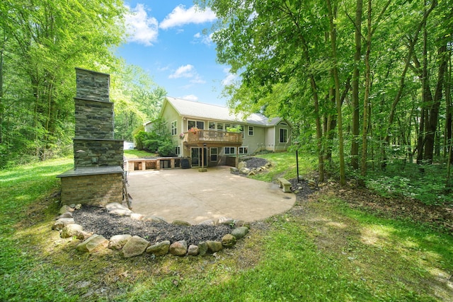 8395 Dalton Rd, Onsted, MI 49265 - rear view of property featuring a patio area, a wooden deck, and a lawn