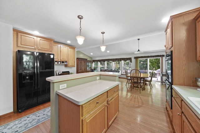 8395 Dalton Rd, Onsted, MI 49265 - kitchen featuring black fridge with ice dispenser, light countertops, a center island, light wood-style flooring, and lofted ceiling