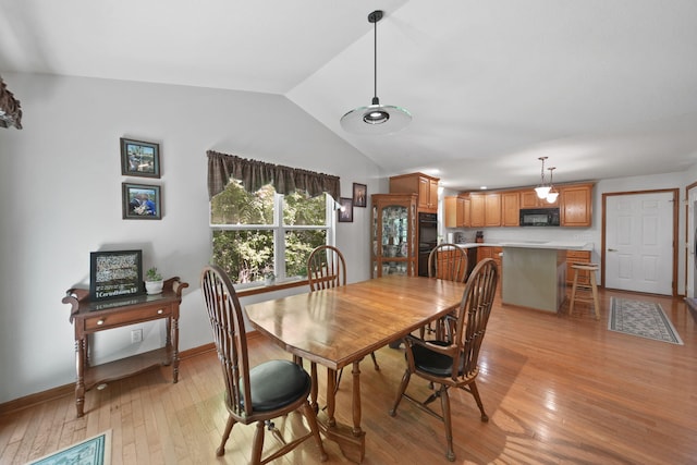 8395 Dalton Rd, Onsted, MI 49265 - dining room featuring light wood-style floors and lofted ceiling