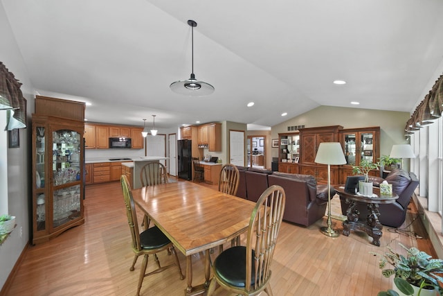 8395 Dalton Rd, Onsted, MI 49265 - dining area featuring light wood-type flooring, lofted ceiling, and recessed lighting