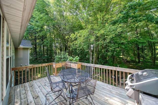8395 Dalton Rd, Onsted, MI 49265 - wooden terrace with a grill and outdoor dining space