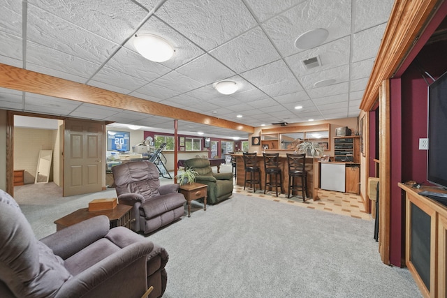 8395 Dalton Rd, Onsted, MI 49265 - living area featuring bar, light carpet, and a paneled ceiling