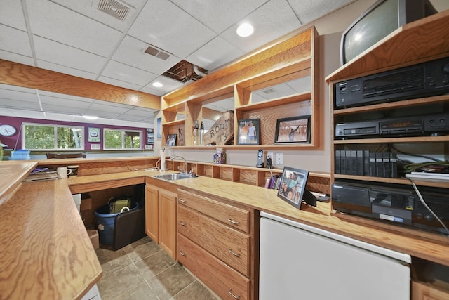 8395 Dalton Rd, Onsted, MI 49265 - kitchen featuring a drop ceiling, fridge, wood counters, and light tile patterned flooring