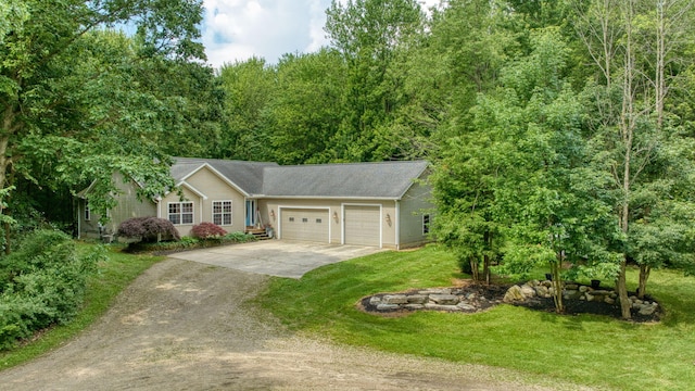 8395 Dalton Rd, Onsted, MI 49265 - ranch-style house featuring driveway, a garage, and a front lawn