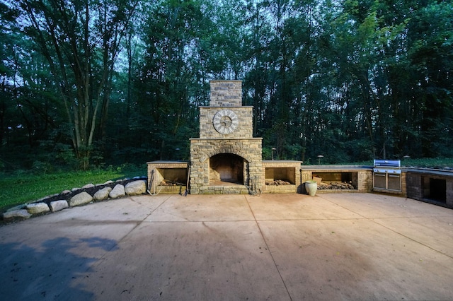 8395 Dalton Rd, Onsted, MI 49265 - view of patio / terrace with an outdoor stone fireplace and exterior kitchen