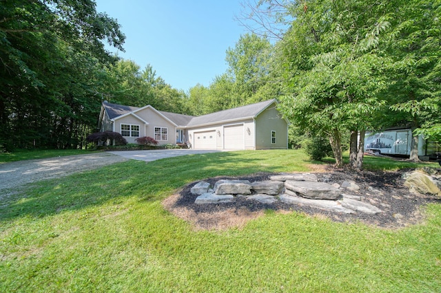 8395 Dalton Rd, Onsted, MI 49265 - view of front of home with a garage, a front yard, and asphalt driveway