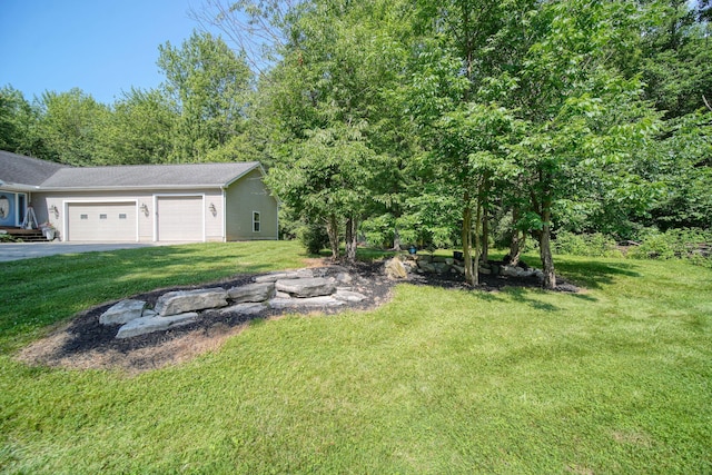 8395 Dalton Rd, Onsted, MI 49265 - view of green lawn featuring an attached garage