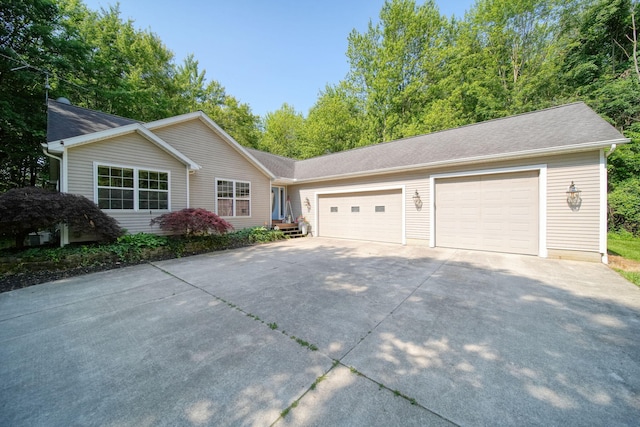8395 Dalton Rd, Onsted, MI 49265 - ranch-style home with driveway and a garage