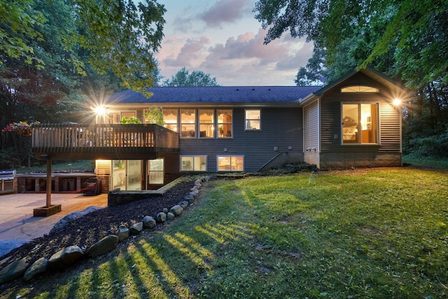 8395 Dalton Rd, Onsted, MI 49265 - rear view of property featuring a lawn, a deck, a patio, and roof with shingles
