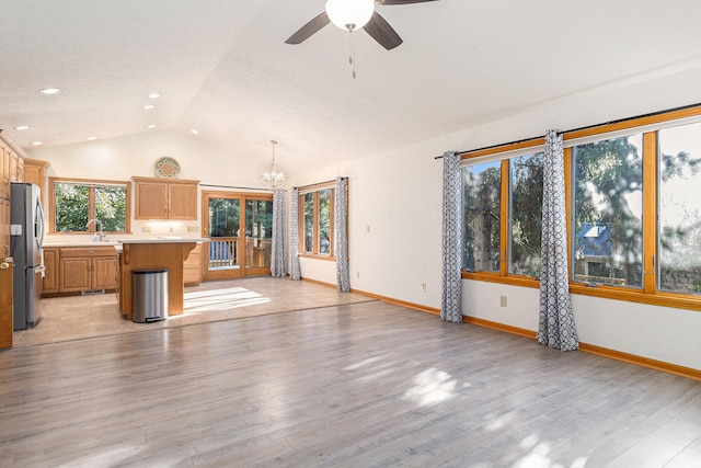 2240 Quincy Ave, Portage, MI 49024 - unfurnished living room with lofted ceiling, a chandelier, ceiling fan, light wood finished floors, and recessed lighting