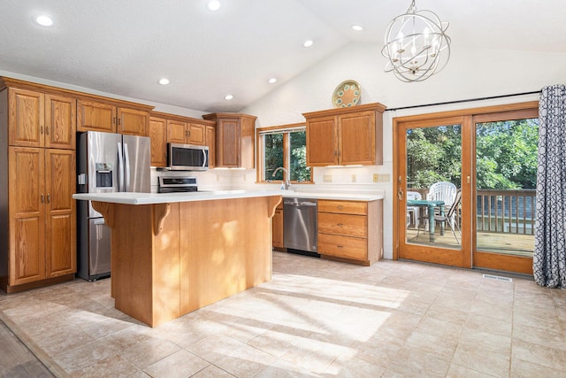 2240 Quincy Ave, Portage, MI 49024 - kitchen with stainless steel appliances, light countertops, recessed lighting, healthy amount of natural light, and high vaulted ceiling