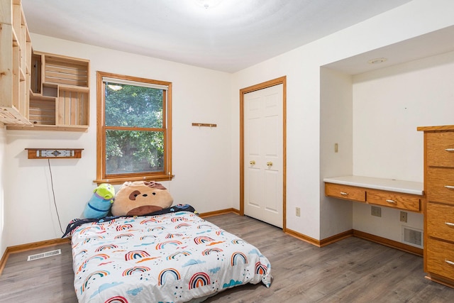 2240 Quincy Ave, Portage, MI 49024 - bedroom with wood finished floors and built in study area