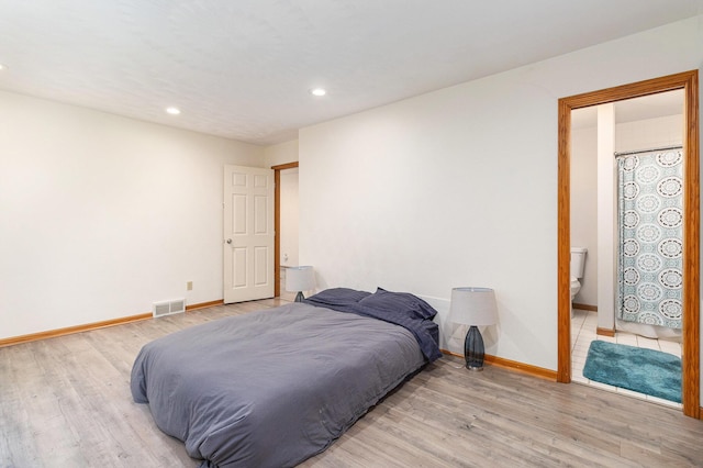 2240 Quincy Ave, Portage, MI 49024 - bedroom featuring light wood-style flooring, recessed lighting, and connected bathroom