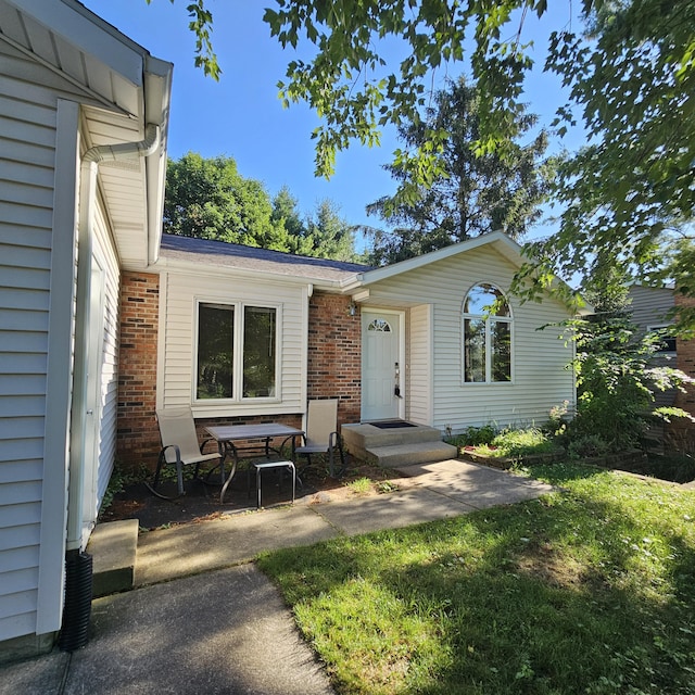2240 Quincy Ave, Portage, MI 49024 - view of front of house with brick siding and a front lawn