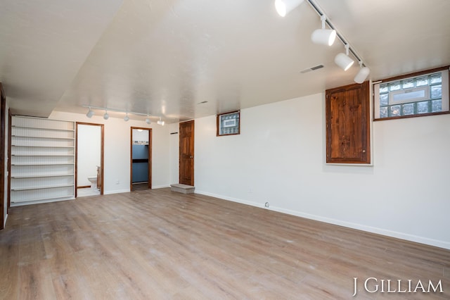 1214 Euna Vista Dr, Holland, MI 49423 - spare room with track lighting and wood finished floors