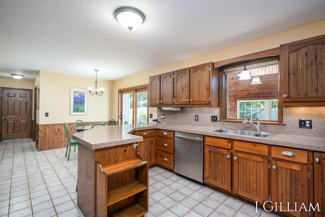 1214 Euna Vista Dr, Holland, MI 49423 - kitchen with dishwasher, wainscoting, plenty of natural light, open shelves, and decorative light fixtures