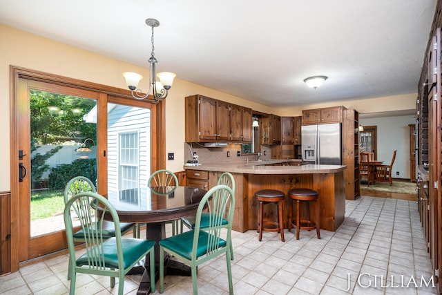 1214 Euna Vista Dr, Holland, MI 49423 - dining room with a chandelier and light tile patterned floors