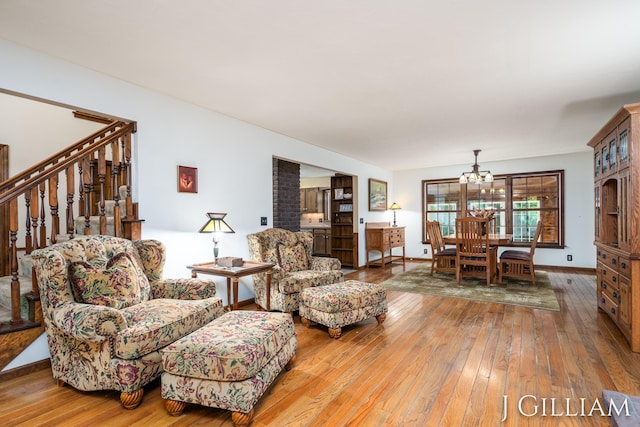 1214 Euna Vista Dr, Holland, MI 49423 - living room featuring a chandelier and wood-type flooring