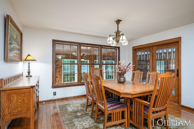 1214 Euna Vista Dr, Holland, MI 49423 - dining space featuring a chandelier and light wood-style floors