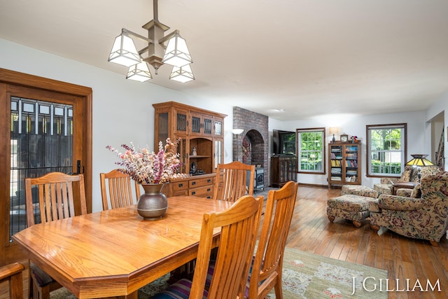 1214 Euna Vista Dr, Holland, MI 49423 - dining room featuring hardwood / wood-style floors and a fireplace