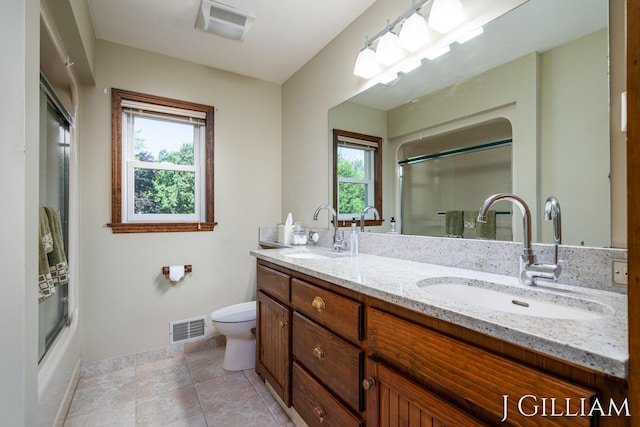 1214 Euna Vista Dr, Holland, MI 49423 - full bath with double vanity, healthy amount of natural light, and combined bath / shower with glass door
