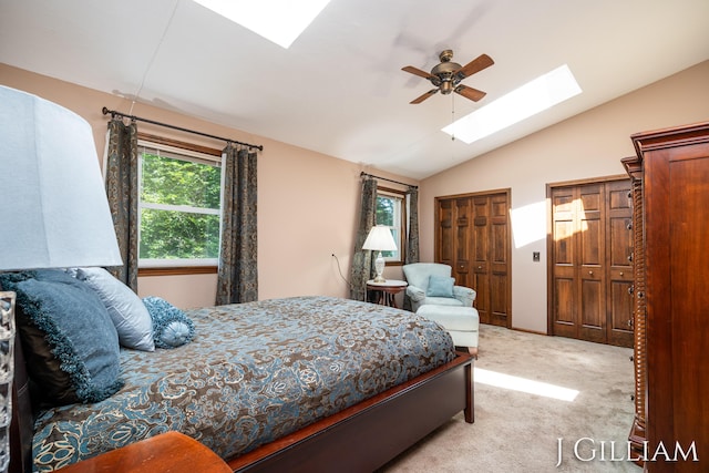 1214 Euna Vista Dr, Holland, MI 49423 - bedroom with a skylight, vaulted ceiling, carpet, two closets, and a ceiling fan