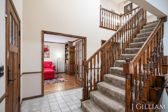 1214 Euna Vista Dr, Holland, MI 49423 - foyer with stairway, tile patterned floors, and a high ceiling