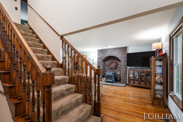 1214 Euna Vista Dr, Holland, MI 49423 - stairs with a wood stove and wood-type flooring