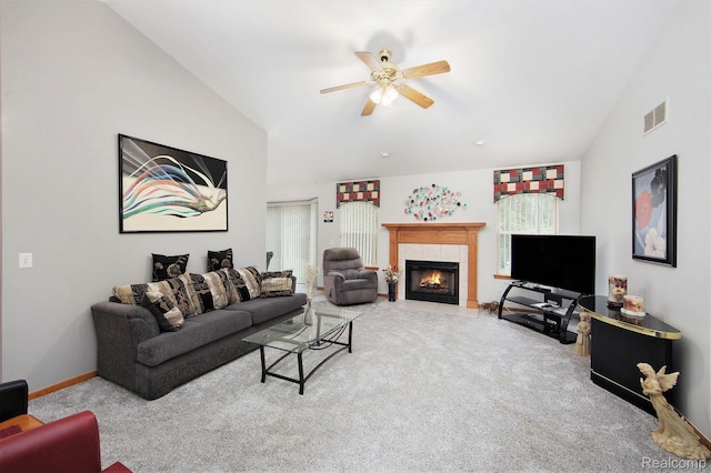32851 Foster Ct, Fraser, MI 48026 - carpeted living area with lofted ceiling, a ceiling fan, and a tile fireplace