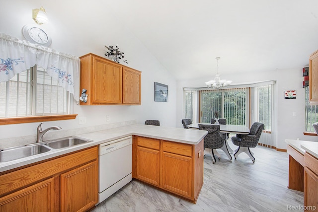 32851 Foster Ct, Fraser, MI 48026 - kitchen featuring white dishwasher, a chandelier, a peninsula, light countertops, and vaulted ceiling