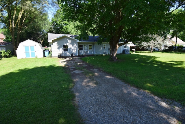 325 Dallas St, Colon, MI 49040 - ranch-style home with a storage shed and a front yard