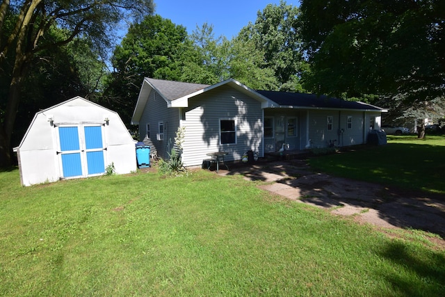 325 Dallas St, Colon, MI 49040 - view of front facade with a storage unit and a front yard