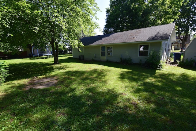 325 Dallas St, Colon, MI 49040 - view of grassy yard with a trampoline