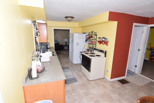 325 Dallas St, Colon, MI 49040 - kitchen with white appliances and light countertops
