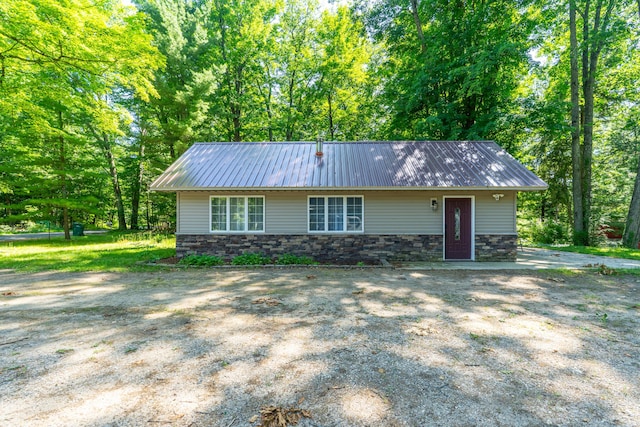11901 187th Ave, Stanwood, MI 49346 - view of front of property featuring stone siding and a metal roof