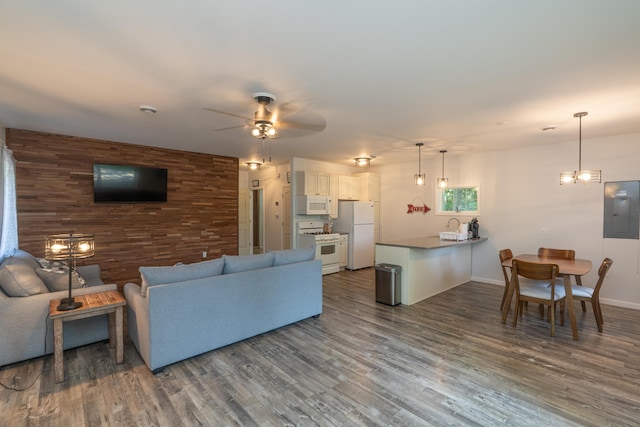 11901 187th Ave, Stanwood, MI 49346 - living room with electric panel, ceiling fan, and dark wood-style flooring