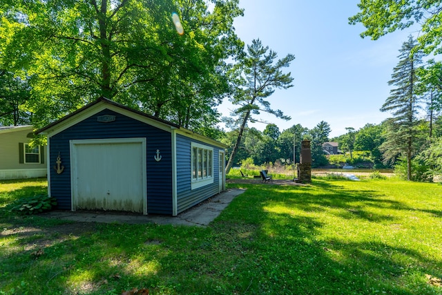 11901 187th Ave, Stanwood, MI 49346 - view of grassy yard featuring an outdoor structure and a garage